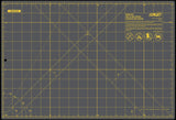 Gray cutting mat with yellow grid and OMTA branding