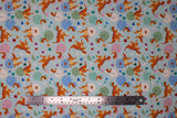 Flat swatch Hatching Dinos fabric (white fabric with hatching orange dinosaurs allover in pastel coloured eggs with confetti shapes)