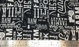 Flat swatch farm to fork large font text printed fabric in black (black fabric with tossed white large print text in various styles all related to farmers markets "farm to fork" "farm fresh" etc.)