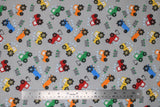 Flat swatch comfy print flannel in tractor (blue/yellow/orange/green/red tractors on light grey)