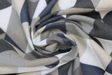 Swirled swatch upholstery fabric (grey geometric print: tiled alternating triangles in white/light to dark greys colourway)