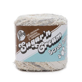 Ball of Scrub Off yarn in shade linen (whites and greys)