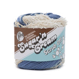 Ball of Scrub Off yarn in shade denim (white and assorted faded blues)
