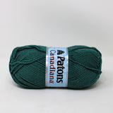 A ball of Patons Canadiana yarn in shade Dark Teal