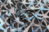 Swirled swatch shark printed fabric in shark grunge (grey and blue open shark mouths tiled on black)