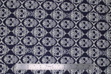 Flat swatch skull printed fabric in ornamental skulls (decorative swirly skull design)