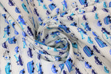 Swirled swatch Handworks Home: Transportation fabric (white fabric with thin dotted black lines/stripes comprising a "road" with assorted blue illustrative style vehicles allover in various styles/shades of blue)