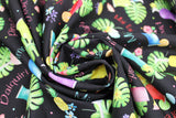 Swirled swatch swatch Drinks Black fabric (black fabric with tossed illustrative style drinks/tropical cocktails with tossed flowers and leaves and drink names in fun colours "Mimosa" "Daiquiri" etc)