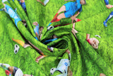 Swirled swatch Womens Soccer fabric (green grass fabric with women soccer players allover and tossed soccer balls)