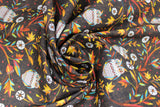 Swirled swatch Autumn Owls fabric (dark brown fabric with tossed colourful fall branches and floral bulbs in white allover with tossed grey and colourful owls)