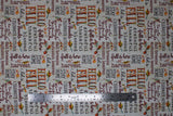 Flat swatch Celebrate Autumn fabric (white/neutral coloured fabric with fall themed text in various styles/colours allover "Hello Fall" "fall is here" etc.)