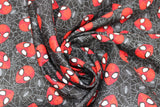 Swirled swatch Marvel's Avengers Spiderman heads (on black) printed fabric