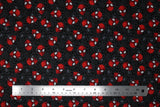 Flat swatch Marvel's Avengers Spiderman heads (on black) printed fabric