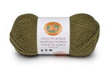 A ball of Lion Brand Touch of Alpaca yarn in olive shade on white background