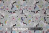 Flat swatch comfy print flannel in unicorn (white and rainbow unicorns on grey with butterflies and rainbows)