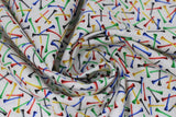 Swirled swatch Tossed Tees fabric (white fabric with tossed golf tee posts allover in black, blue, green, yellow, red)