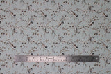 Flat swatch Bird fabric (white fabric with lines of brown branches allover with small white floral and white birds - some black in head on branches)