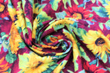 Swirled swatch Burgundy Sunflowers fabric (burgundy fabric with large tossed yellow, orange and red realistic look sunflowers)