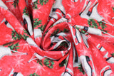 Swirled swatch Ice Skates fabric (red marbled look fabric with tossed white snowflakes, pairs of white figure skates with green holly sticking out of foot holes)