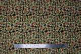 Flat swatch I See You fabric (green eyes in brown spherical eye sockets tossed allover)