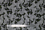 Flat swatch Mumified fabric (black fabric with large tossed drawn/illustrative style wrapped mummies with glowing green eyes and tossed green eyes on black)