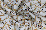 Swirled swatch Chop Sticks fabric (white fabric with tossed Chop Sticks allover in natural colour with black and orange top banding)