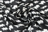 Swirled swatch white fabric (black fabric with tossed white 3D drawing style lightning bolts)