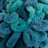 Seaport Teals (teal and turquoise shades) swatch of Bernat Alize Blanket EZ looped yarn