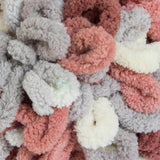 Warm Clay (grey, cream and terracotta) swatch of Bernat Alize Blanket EZ looped yarn