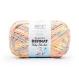 Ball of Bernat Baby Blanket yarn in shade Spring Blossom (pale orange/peach, yellow and grey)