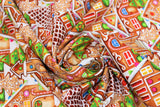 Swirled swatch House Stack fabric (white fabric with busy collaged gingerbread houses allover with bright coloured decorations)