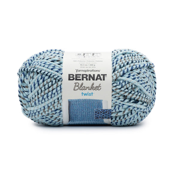 A ball of Bernat Blanket Twist in colourway Sea and Stars (soft turquoise twisted with grey and navy)