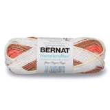 Small ball of Bernat Handicrafter Stripes in colourway Natural Stripes (coral, mid brown, ivory, white)