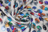 Swirled swatch helmets white fabric (white fabric with small tossed football helmets in full colour, various colours)