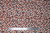 Flat swatch footballs white fabric (white fabric with small tossed brown footballs allover and orange/black number/letter signs)