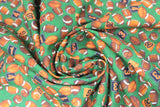 Swirled swatch footballs green fabric (green fabric with small tossed brown footballs allover and orange/black number/letter signs)