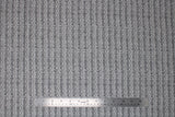 Flat swatch touchdown fabric (grey fabric with tiny stripes of "TOUCHDOWN!" text alternating with tiny grey footballs stripes)