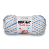 A ball of Bernat Softee Baby yarn in shade little boy blue (white, beige, light to medium blue colourway)