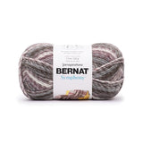 A ball of Bernat Symphony yarn in shade Pebbles (white, greys, browns and pale pinks in twisted shades)