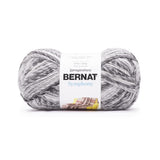 A ball of Bernat Symphony yarn in shade Granite (white and light to dark greys in twisted shades)