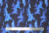 Flat swatch celestial unicorn fabric (dark blue/purple night sky look fabric with tiny white star dots and light blue organic form unicorn shapes)