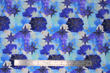 Flat swatch stars fabric (white, light/medium/dark blue organic circular shapes layered with tossed gold stars and star outlines)