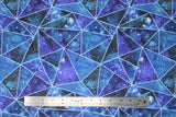 Flat swatch geometric print fabric (assorted sized triangle fabric with light blue separating lines and dark blue and white star galaxy backgrounds within)