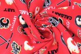 Swirled swatch NHL printed fabric in Calgary Flames (multi logo on red)