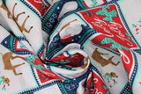 Swirled swatch Patch fabric (white, red, and navy square and rectangle christmas themed patches with christmas text and/or graphics within: santa heads, reindeer, "Ho Ho Ho" "Holly Jolly" etc)