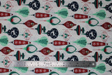 Flat swatch Ornaments fabric (white fabric with bulb and carrot shaped christmas ornaments allover in green, red and navy with christmas related graphics: deer, santa heads, holly, trees, etc.)
