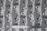 Flat swatch Village fabric (grey fabric with white snowy hillside look lines with white houses and grey/black trees with gold sparkle stars, etc.)