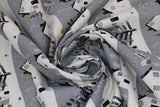 Swirled swatch Village fabric (grey fabric with white snowy hillside look lines with white houses and grey/black trees with gold sparkle stars, etc.)