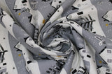 Swirled swatch Village fabric (grey fabric with white snowy hillside look lines with white houses and grey/black trees with gold sparkle stars, etc.)