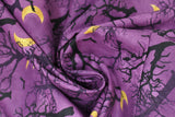Swirled swatch Forest fabric (purple subtle marbled look fabric with tossed black trees and branches silhouettes with black birds and yellow moons)